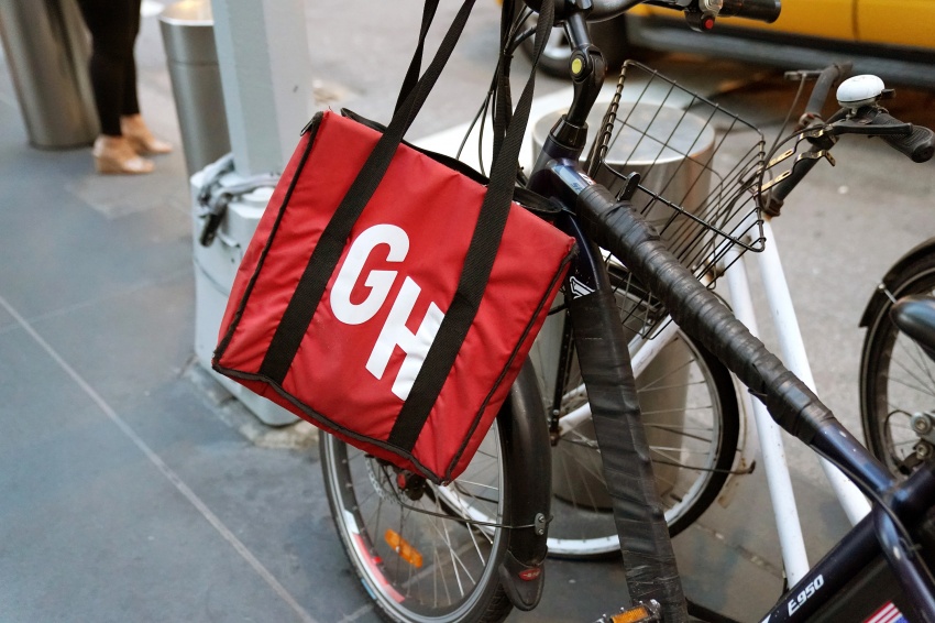 A Grubhub logo on a delivery bag